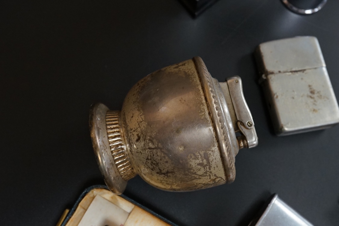 Ten assorted lighters including two Dunhill examples, a Ronson and Dupont, largest 12cm high